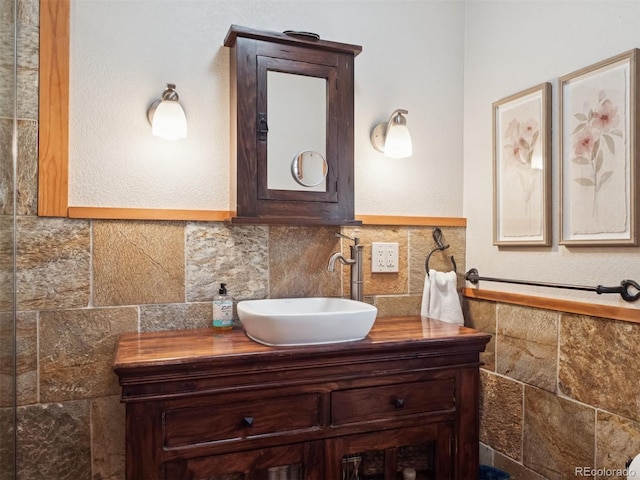 27905 Mariposa Rd, Evergreen, CO 80439 - bathroom featuring vanity and tile walls