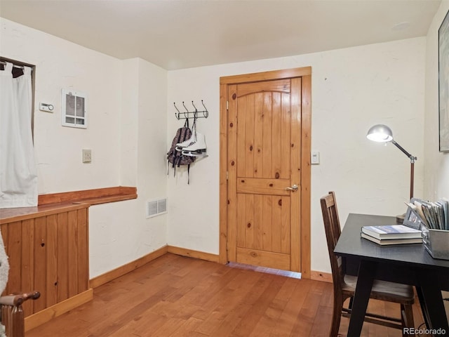 27905 Mariposa Rd, Evergreen, CO 80439 - dining room featuring baseboards, visible vents, and light wood finished floors
