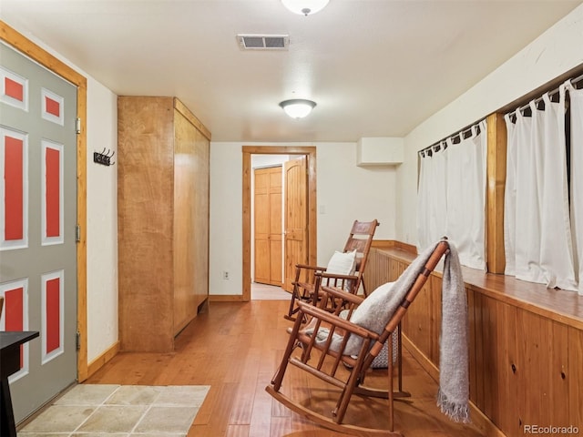 27905 Mariposa Rd, Evergreen, CO 80439 - living area featuring baseboards, light wood finished floors, and visible vents