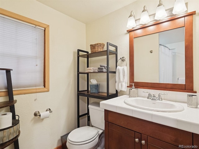27905 Mariposa Rd, Evergreen, CO 80439 - full bathroom with toilet and vanity