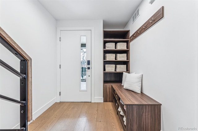 entryway with light hardwood / wood-style floors