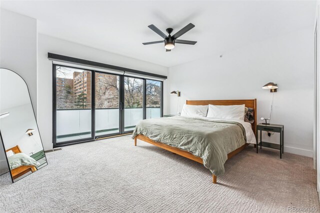 bedroom with access to outside, ceiling fan, and carpet