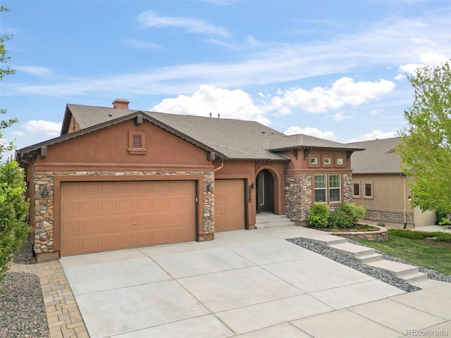 2423 Delicato Ct, Colorado Springs, CO 80921 - view of front of house featuring stucco siding, stone siding, an attached garage, driveway, and a shingled roof