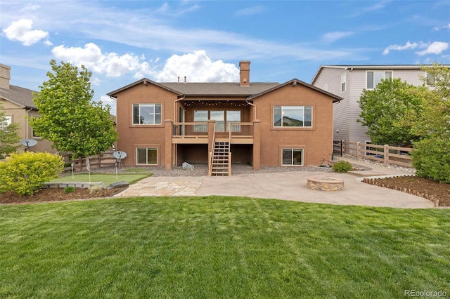 2423 Delicato Ct, Colorado Springs, CO 80921 - rear view of house featuring a fire pit, stucco siding, a patio area, a wooden deck, and stairs