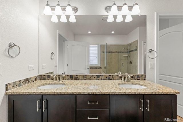 2423 Delicato Ct, Colorado Springs, CO 80921 - bathroom with a stall shower and double vanity