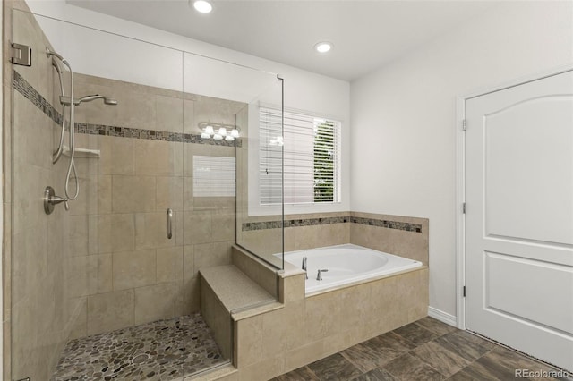 2423 Delicato Ct, Colorado Springs, CO 80921 - bathroom with a shower stall, a bath, and recessed lighting