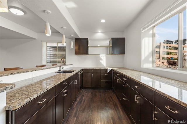 2423 Delicato Ct, Colorado Springs, CO 80921 - kitchen featuring a sink, plenty of natural light, dark wood-type flooring, a peninsula, and recessed lighting