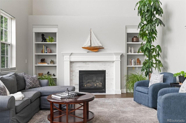 5984 S Paris Pl, Greenwood Village, CO 80111 - living area with wood finished floors and a tiled fireplace