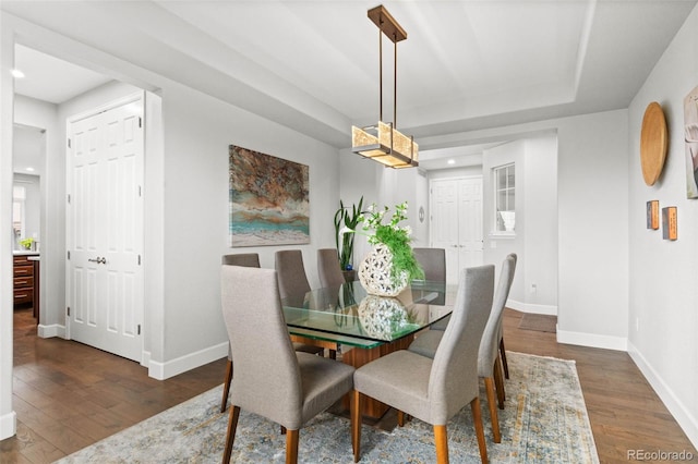 5984 S Paris Pl, Greenwood Village, CO 80111 - dining space with dark wood-type flooring, recessed lighting, and a tray ceiling