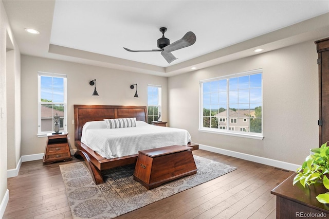 5984 S Paris Pl, Greenwood Village, CO 80111 - bedroom with a raised ceiling, hardwood / wood-style flooring, recessed lighting, and ceiling fan