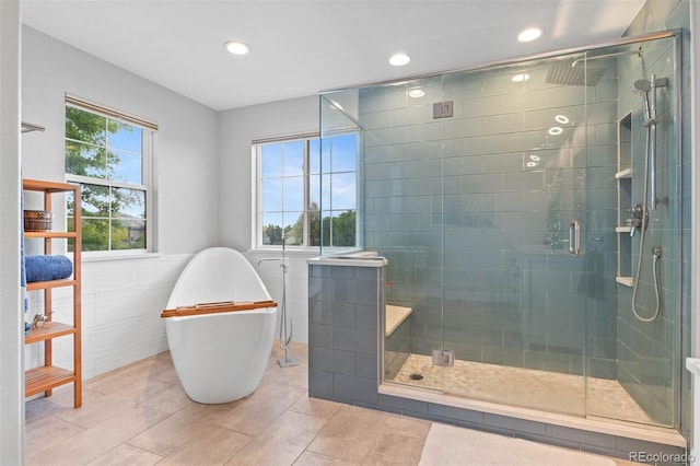 5984 S Paris Pl, Greenwood Village, CO 80111 - full bath featuring tile walls, a stall shower, a soaking tub, recessed lighting, and tile patterned flooring