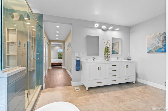 5984 S Paris Pl, Greenwood Village, CO 80111 - ensuite bathroom with double vanity, a shower stall, and recessed lighting
