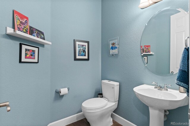 5984 S Paris Pl, Greenwood Village, CO 80111 - bathroom with wood finished floors and toilet