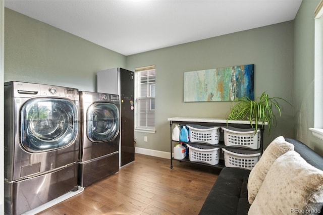 5984 S Paris Pl, Greenwood Village, CO 80111 - laundry area with separate washer and dryer and wood finished floors