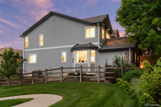 5984 S Paris Pl, Greenwood Village, CO 80111 - back of house at dusk with a tiled roof