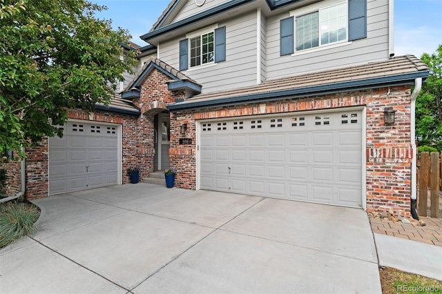 5984 S Paris Pl, Greenwood Village, CO 80111 - traditional-style house with brick siding, driveway, and a garage