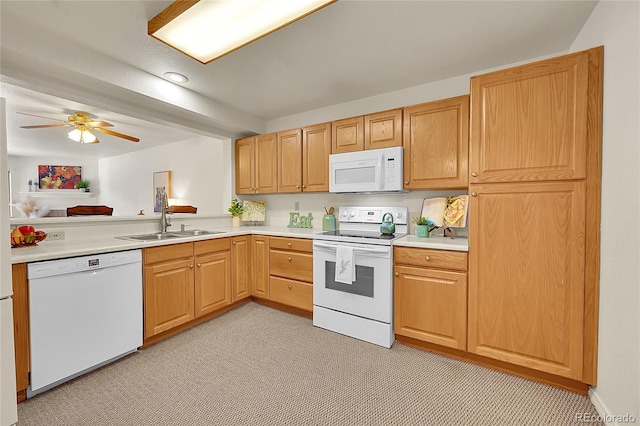 kitchen with ceiling fan, light carpet, sink, and white appliances