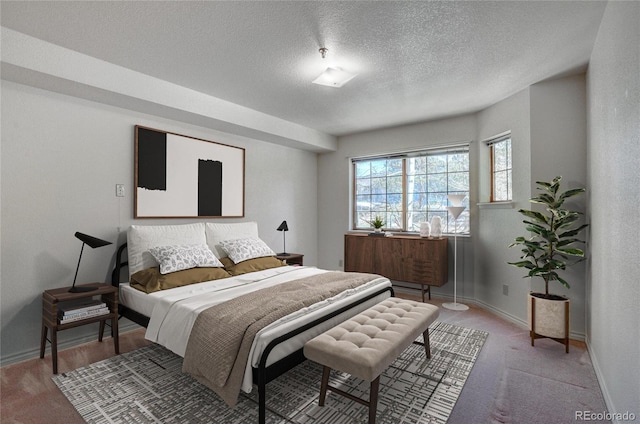 carpeted bedroom with a textured ceiling