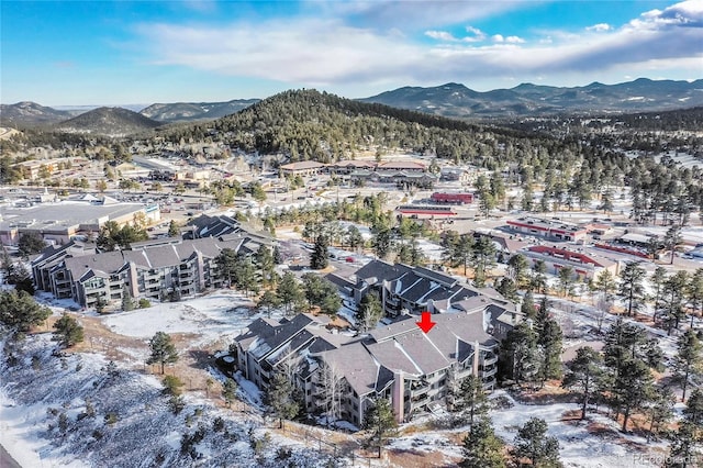 snowy aerial view with a mountain view