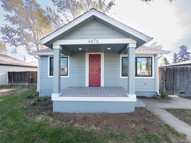 4476 S Grant St, Englewood, CO 80113 - view of front of property featuring a shingled roof and fence