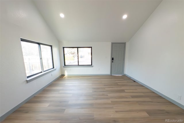 4476 S Grant St, Englewood, CO 80113 - empty room featuring baseboards, vaulted ceiling, light wood finished floors, and recessed lighting
