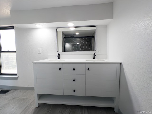 4476 S Grant St, Englewood, CO 80113 - bathroom with a tile shower, visible vents, a sink, and double vanity