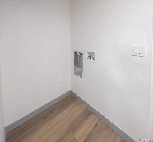 4476 S Grant St, Englewood, CO 80113 - laundry area with baseboards, hookup for a washing machine, laundry area, and light wood-type flooring