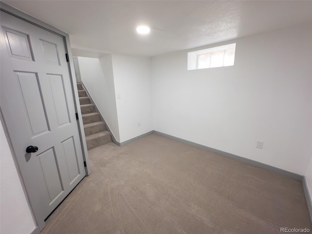 4476 S Grant St, Englewood, CO 80113 - below grade area featuring baseboards, carpet flooring, and stairs
