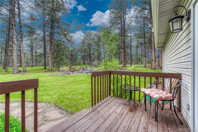 18470 Canterbury Dr, Monument, CO 80132 - wooden terrace with a lawn