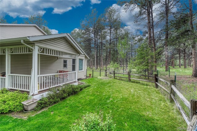 18470 Canterbury Dr, Monument, CO 80132 - view of yard featuring covered porch