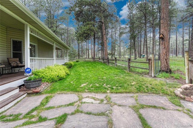 18470 Canterbury Dr, Monument, CO 80132 - view of yard with covered porch