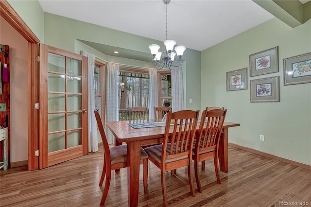 18470 Canterbury Dr, Monument, CO 80132 - dining space with light wood finished floors and a chandelier