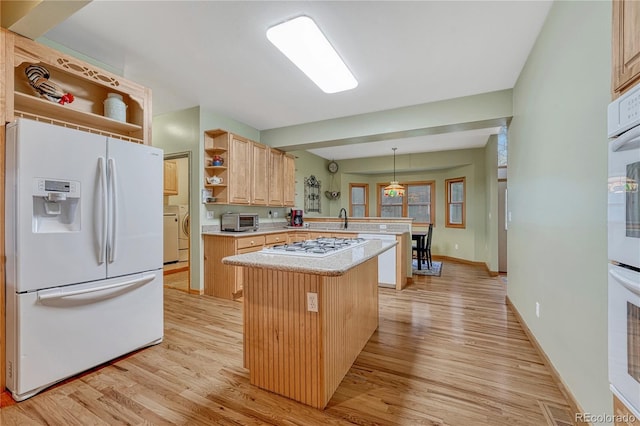 18470 Canterbury Dr, Monument, CO 80132 - kitchen featuring white refrigerator with ice dispenser, open shelves, a peninsula, light brown cabinetry, and light wood-style floors