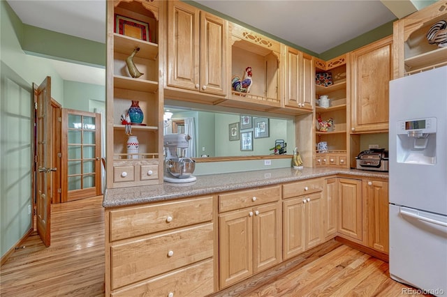 18470 Canterbury Dr, Monument, CO 80132 - kitchen featuring open shelves, white fridge with ice dispenser, light wood-style flooring, and light countertops