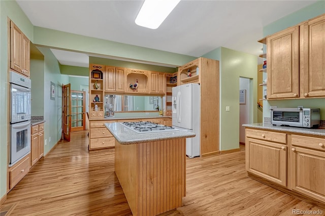 18470 Canterbury Dr, Monument, CO 80132 - kitchen featuring open shelves, white appliances, light wood-style floors, and a kitchen island