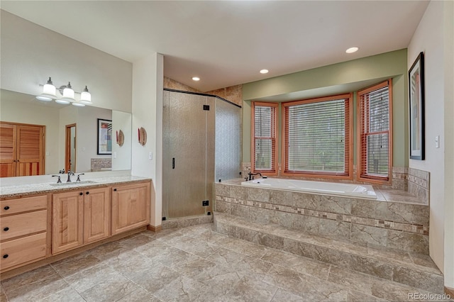 18470 Canterbury Dr, Monument, CO 80132 - full bath with a bath, vanity, a stall shower, and recessed lighting