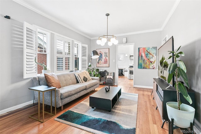 living room featuring a notable chandelier, crown molding, and wood-type flooring