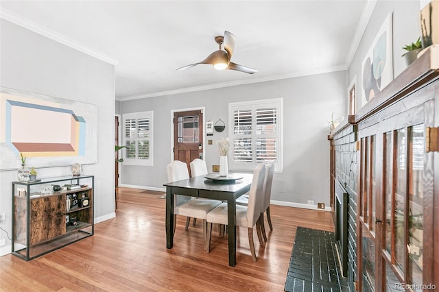 525 N Pearl St, Denver, CO 80203 - dining space featuring a ceiling fan, wood finished floors, baseboards, and ornamental molding