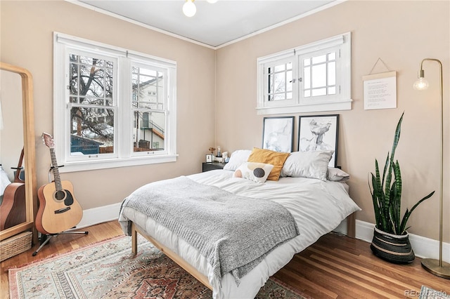 525 N Pearl St, Denver, CO 80203 - bedroom featuring baseboards, crown molding, and wood finished floors
