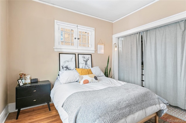 525 N Pearl St, Denver, CO 80203 - bedroom featuring crown molding and wood finished floors