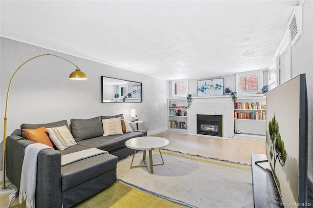 525 N Pearl St, Denver, CO 80203 - living room featuring visible vents, a fireplace, and baseboards