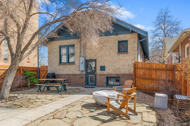 525 N Pearl St, Denver, CO 80203 - back of house with brick siding, fence, and a patio area