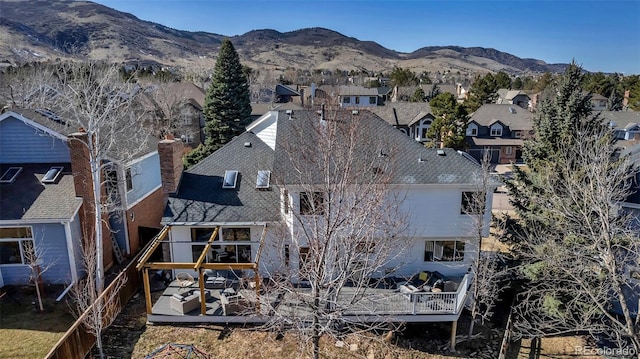 birds eye view of property with a residential view and a mountain view