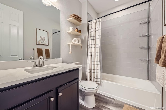 bathroom with shower / tub combo with curtain, vanity, toilet, and wood finished floors