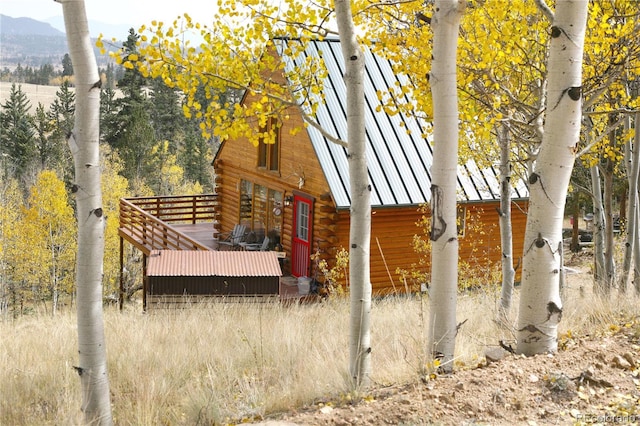 179 Mountain Vis, Como, CO 80432 - view of side of home with log exterior, a deck with mountain view, and metal roof