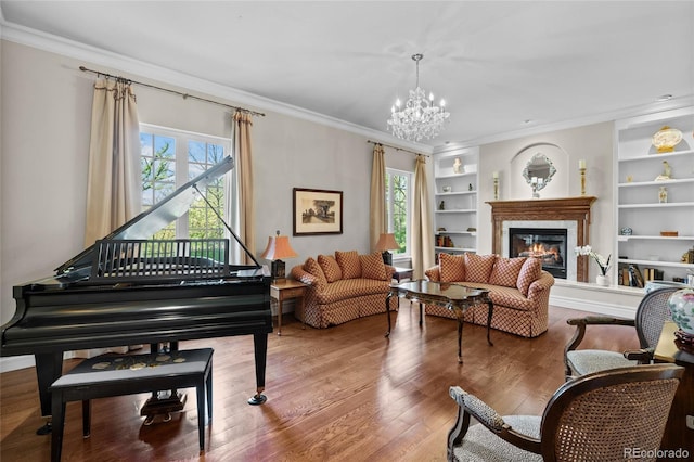 1160 Monaco Pkwy, Denver, CO 80220 - living area with healthy amount of natural light, a chandelier, crown molding, a glass covered fireplace, and wood finished floors