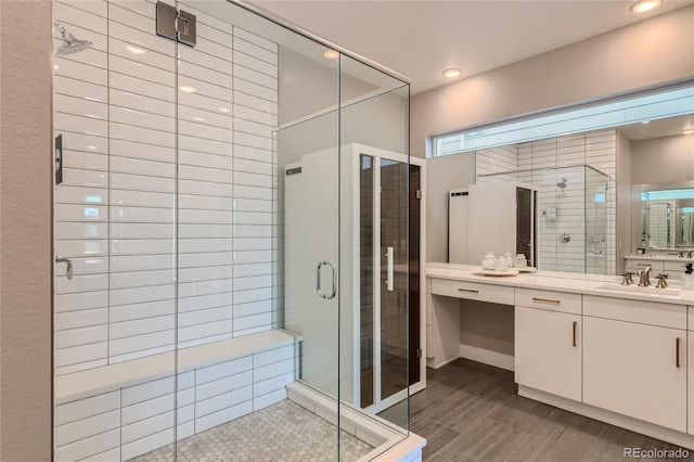 full bath with recessed lighting, a shower stall, and vanity