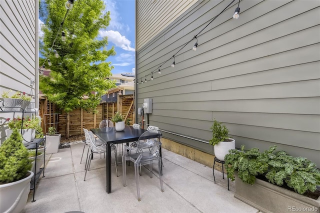 view of patio / terrace with outdoor dining area and fence