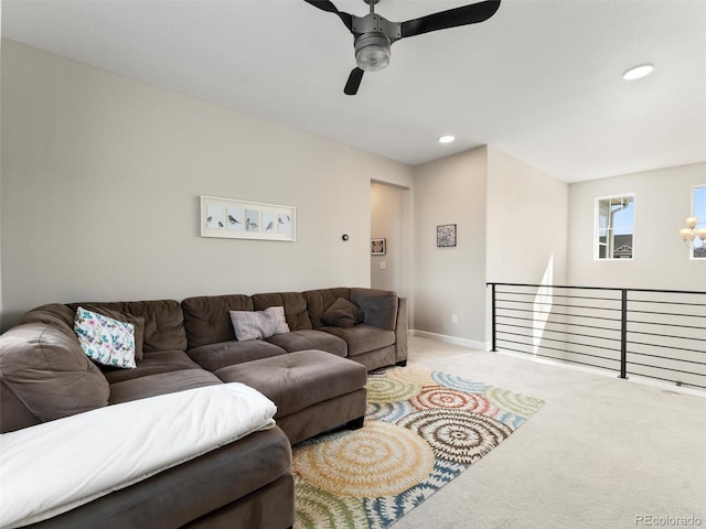 living room with a ceiling fan, recessed lighting, carpet, and baseboards