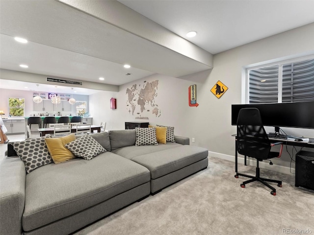 carpeted living room featuring recessed lighting and baseboards